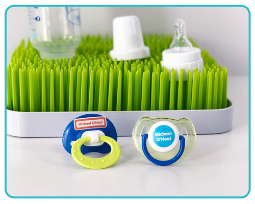 Pacifiers and small daycare items labeled with mini waterproof name labels, demonstrating how to label small items that easily get lost at daycare